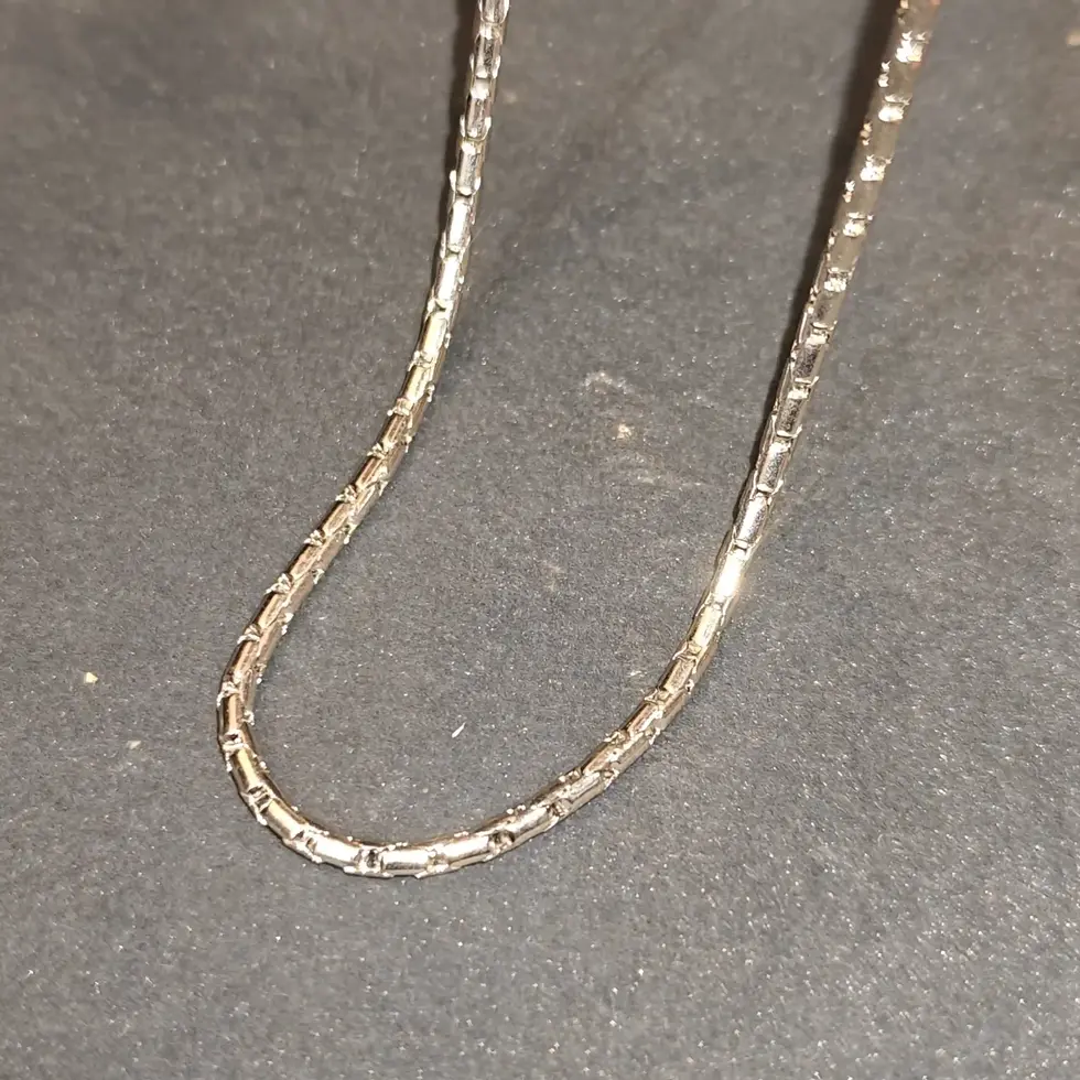 Long silver-tone men's chain with a sleek geometric link pattern, designed for a clean and modern everyday look.