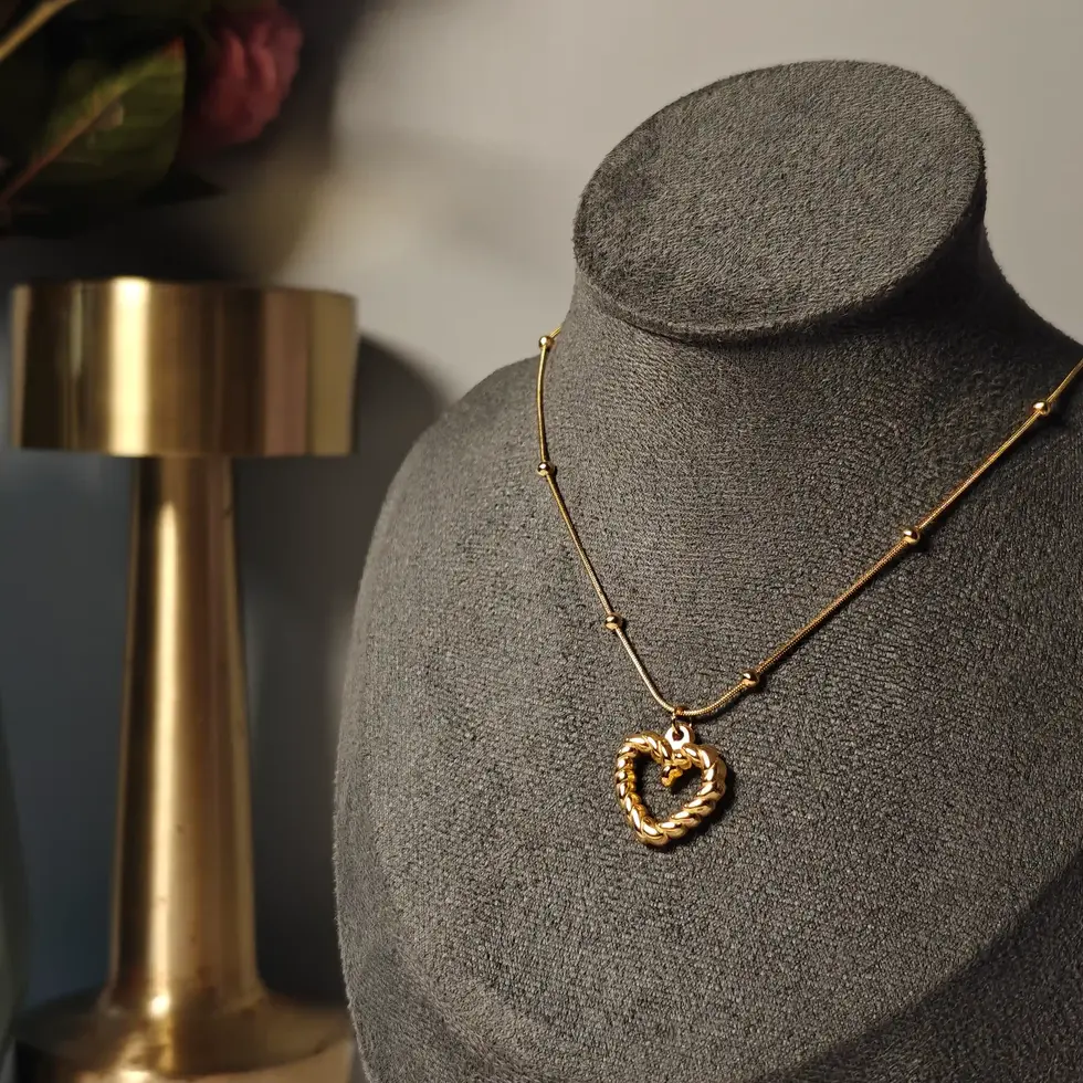 Gold ball-beaded chain necklace with a bold heart pendant