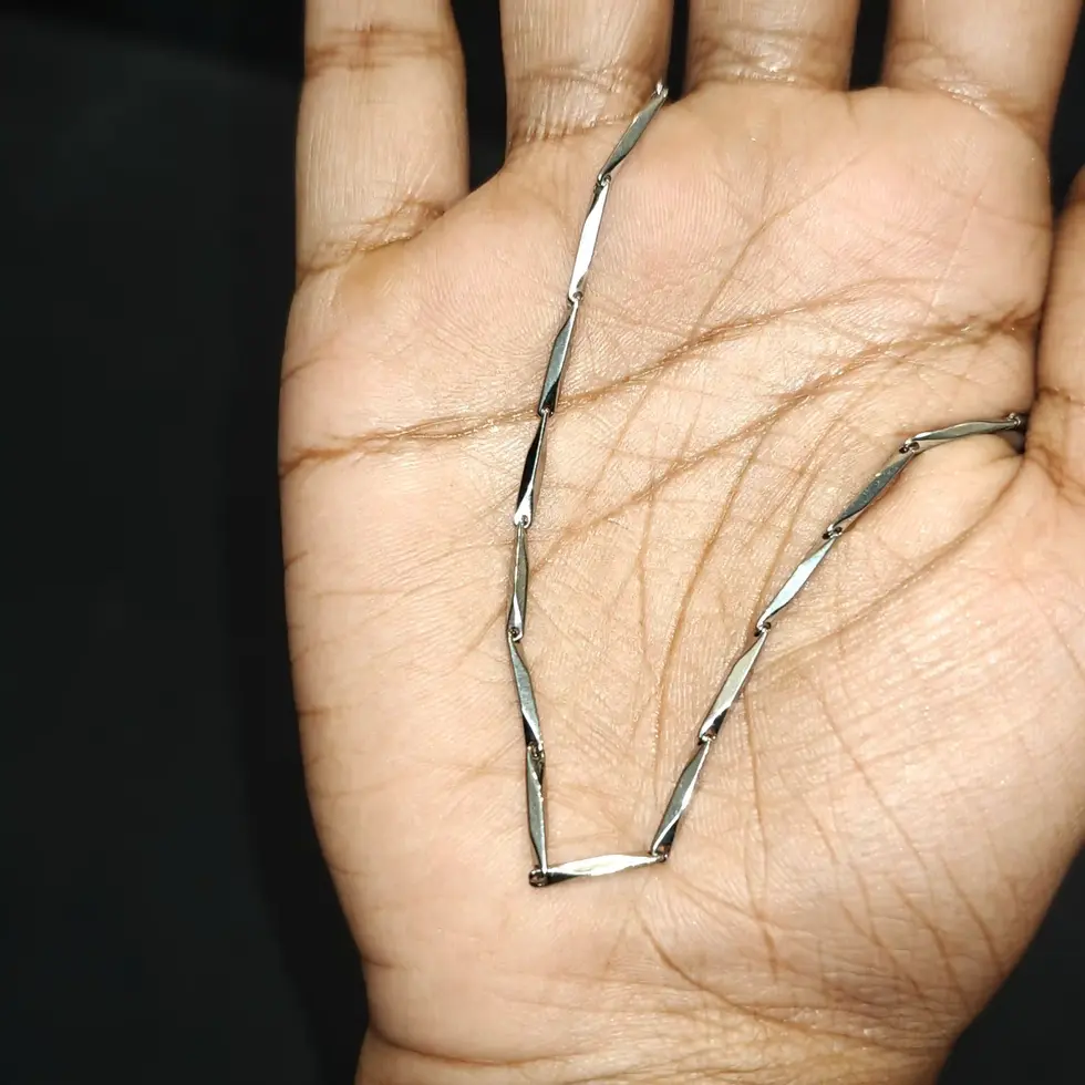 Long silver-tone men's chain with a slim elongated bar-link design, offering a clean and minimal everyday look.
