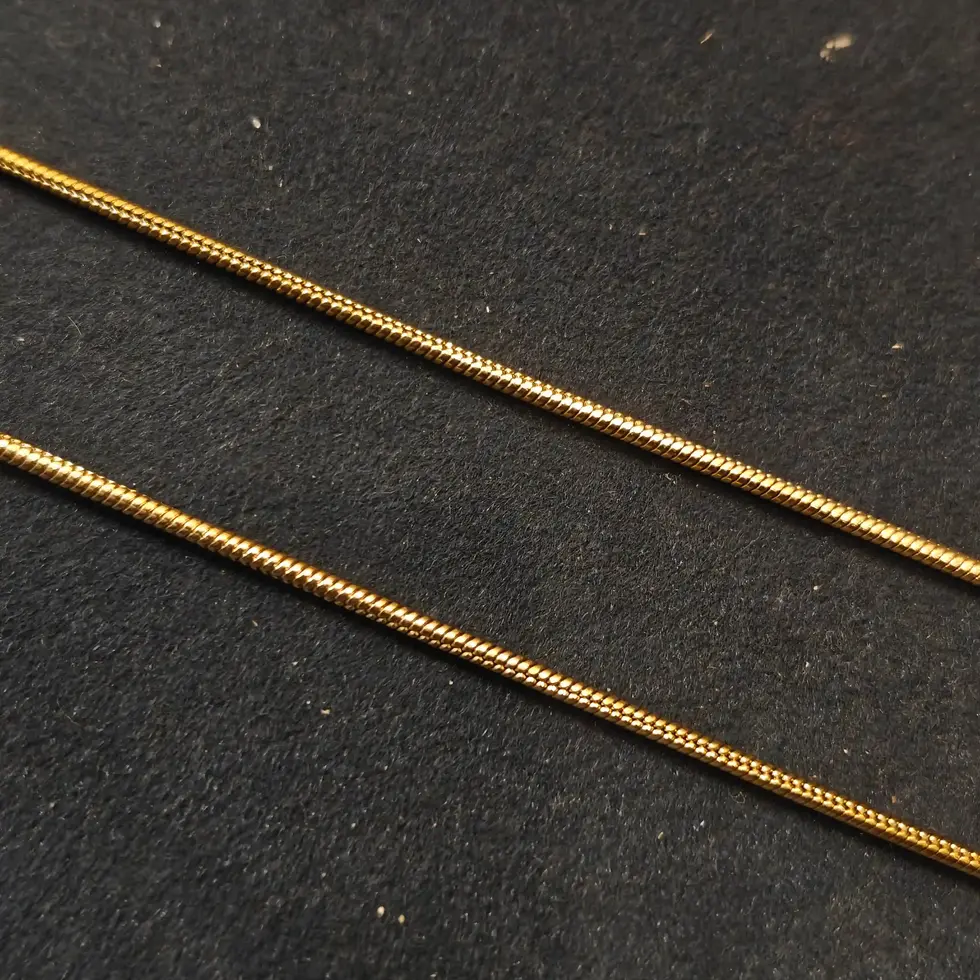 Long gold-tone men's snake chain with a sleek, smooth finish, perfect for a clean and minimal everyday style.