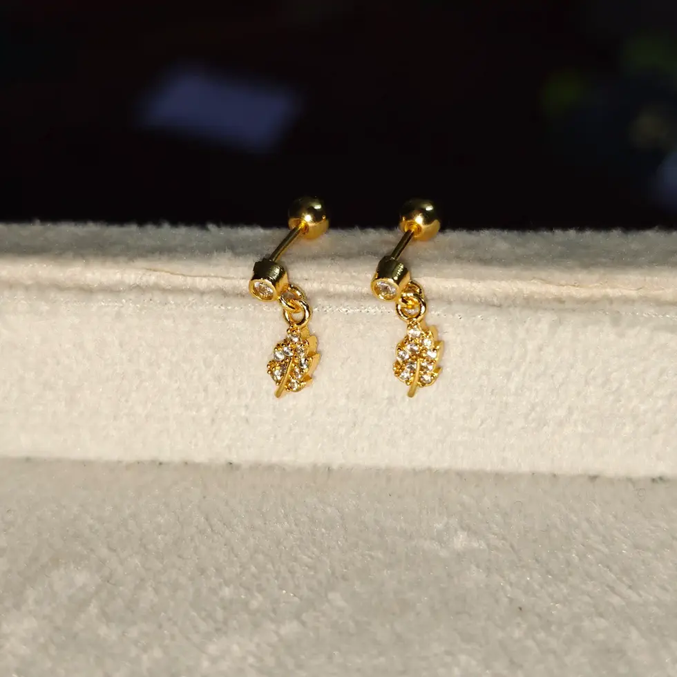 Gold-toned cascading ball stud earrings with a minimal drop design