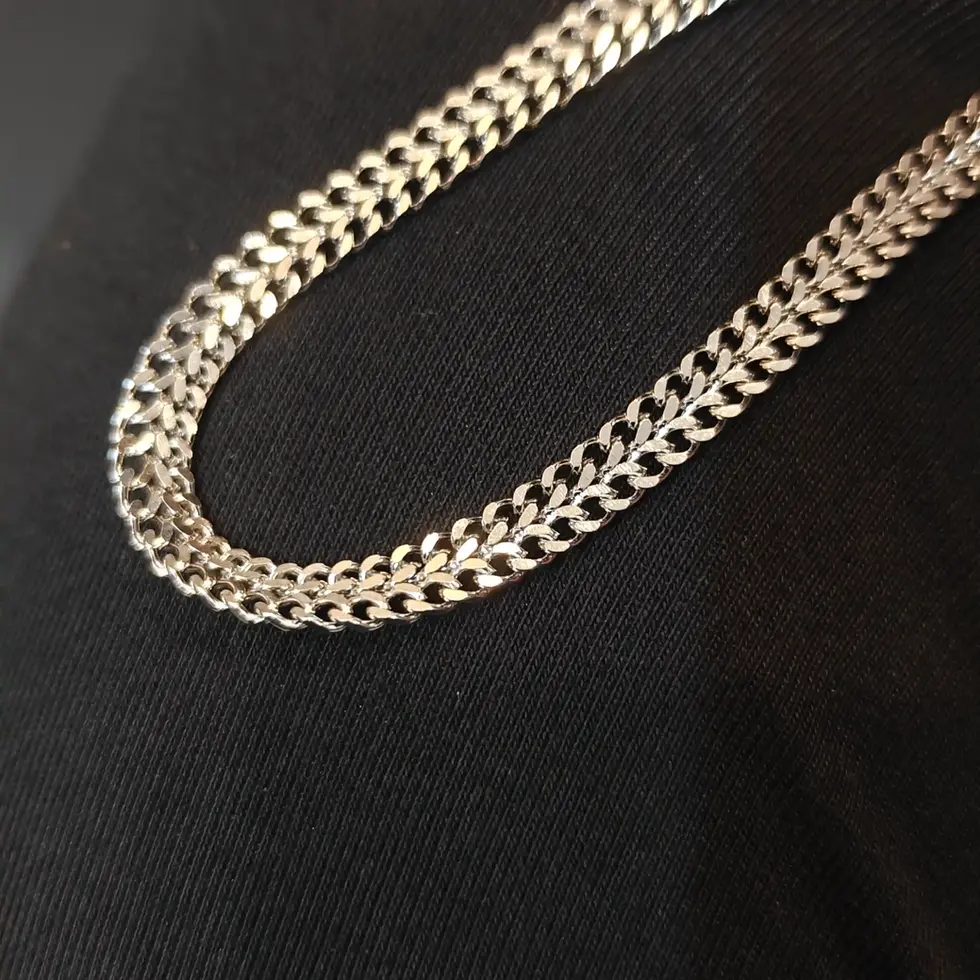 Long silver-tone men's curb chain with a bold flat-link design, perfect for making a clean everyday statement.