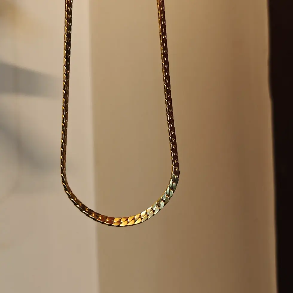 Gold-tone unisex chevron-link chain necklace with a polished finish and 56 cm medium-length fit.