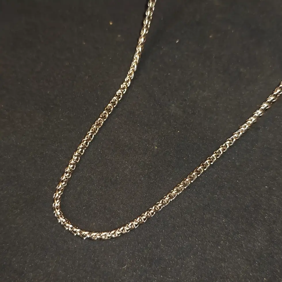 Long silver-tone men's twisted chain with an intricate woven design, offering a sleek and modern everyday look.