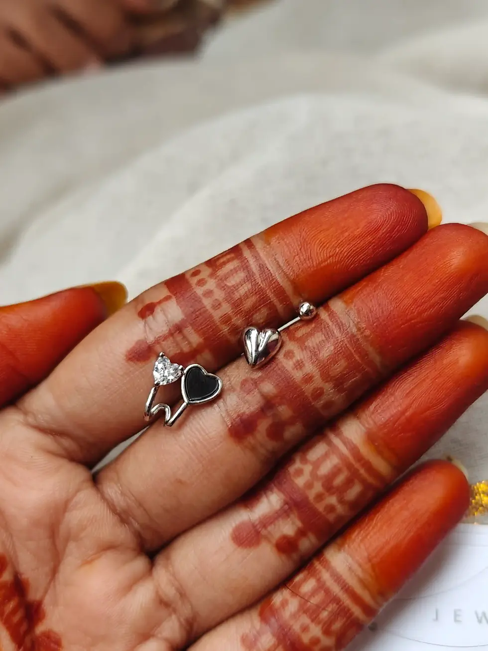 Silver 3-piece stud earring set with black heart, silver heart, and tiny stone stud