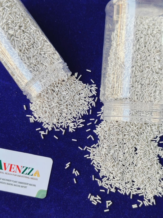 Close-up of white precision textile particles for industrial automation
