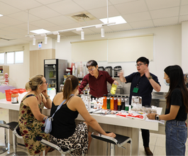 Instructor teaching students how to make authentic Taiwanese bubble tea with premium ingredients.