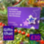 A small blue card with white stars and a Mummy's Star pin badge attached. The words 'Gifts That Give' and '£30' in white and pink text beneath