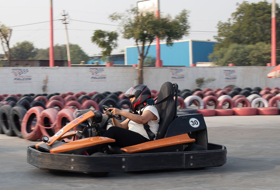 a person driving on pink falcon Jaipur track