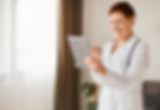 smiley-elder-covid-recovery-center-female-doctor-with-tablet-stethoscope.jpg
