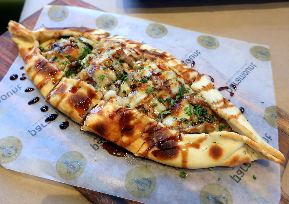Freshly baked boat-shaped pie stuffed with authentically seasoned chicken shawarma, pickles, garlic sauce and topped off with mozzarella cheese.