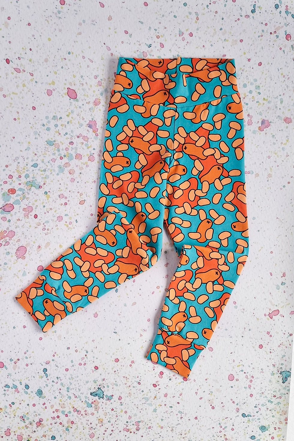 Blue leggings with a beans and sausage pattern. Simpson + C quirky kids clothes handmade in Scotland.