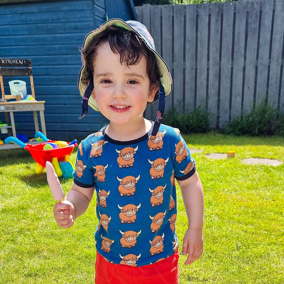 Thumbnail: A child wearing a handmade highland cow t shirt - Simpson + C handmade children's clothing