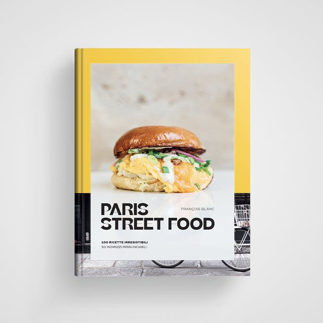 Copertina del libro Paris Street Food con titolo e autore evidenziati, su sfondo che rievoca le strade di Parigi.