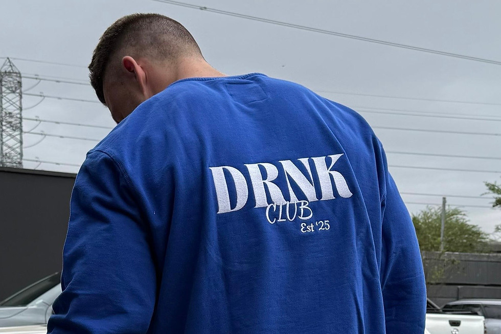 Blue DRNK. Matcha Café sweater displayed in Umhlanga café