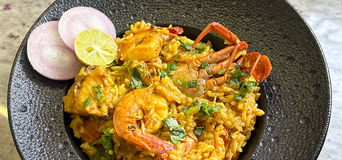 A rice based seafood medly dish called Kolambi bhat with prawns and crabs