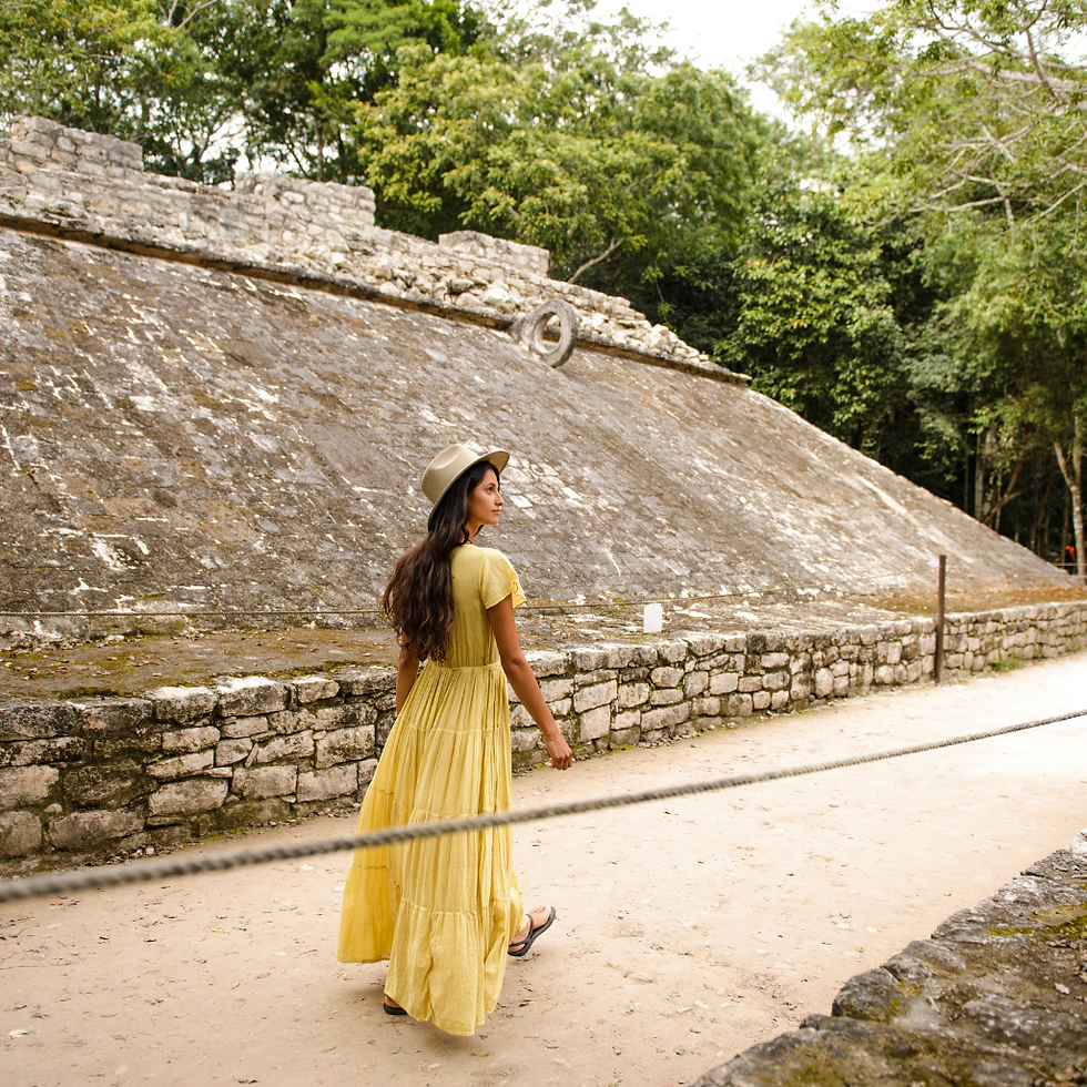 Ancient Mayan ruins of Coba, with a girl walking and enjoying tranquility, a must-visit site for adventure seekers exploring Playa Akumal with FishAndTripTours.