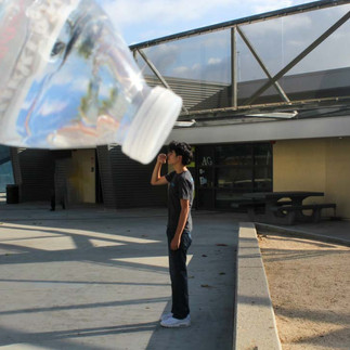 Dylan is drinking from a big water bottle