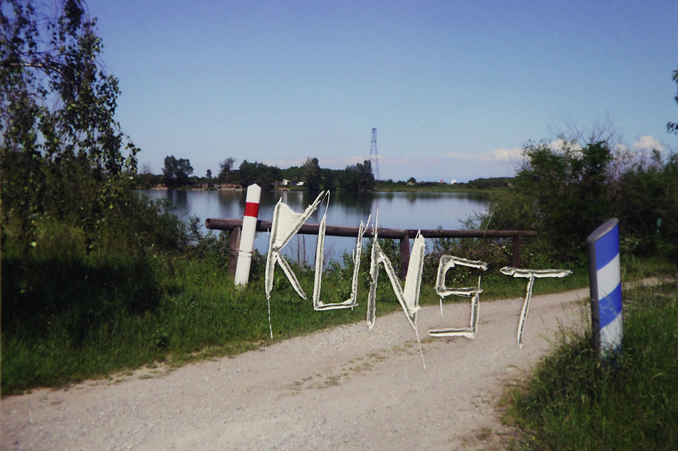 Photograph taken on search for location to do the penance inscribed with the word Kunst going through the print into the aluminium