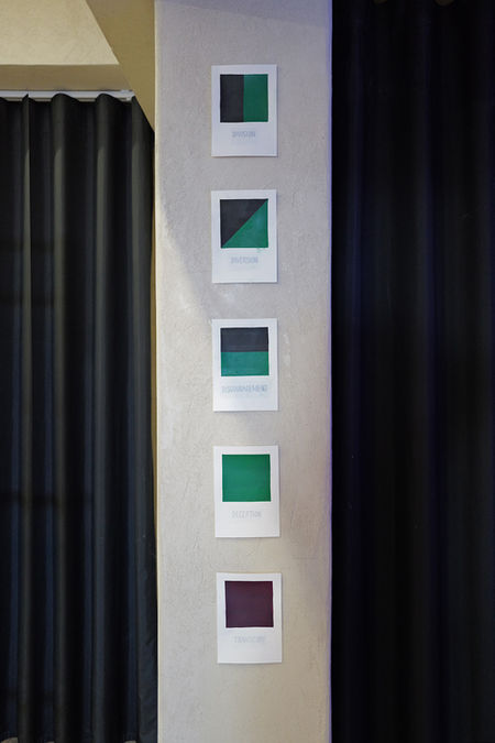 Intervention Cards Green and Purple installed against concrete pillar