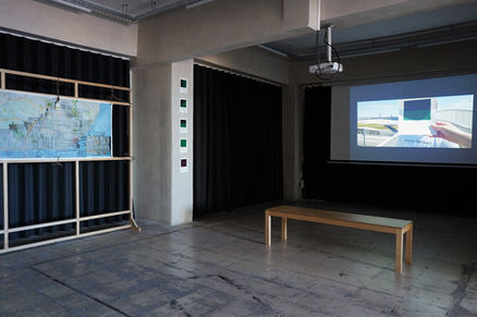 Cinema space where the video is shown and cards are installed to a pillar and the map to a wooden frame