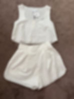 Elegant and breezy, this two-piece summer set features delicate embroidery and scalloped edges, perfect for a feminine look in warm weather.