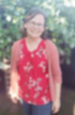 Photograph of smiling author Elizabeth Sullivan outdoors in Wisconsin sunshine