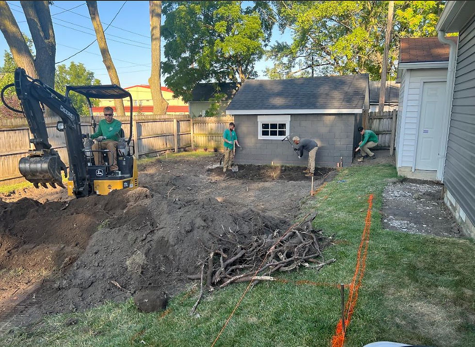 Solid Ground Solutions preparing the site for paver patio installation in Indianapolis, leveling and grading the area for a durable foundation.