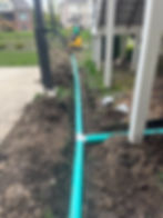 Solid Ground Solutions installing a buried drainage system in Indianapolis, ensuring proper water management and preventing foundation damage.