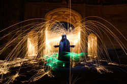 cloaked steel wool spinning light painting at wells cathedral.jpeg