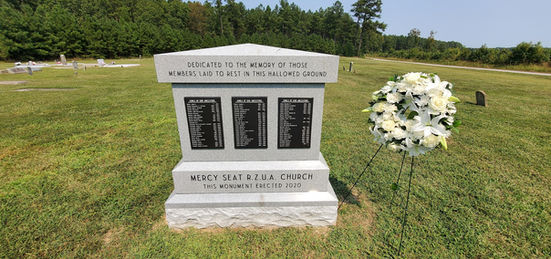 Stone monument with plaques