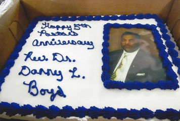 A cake that says Happy 5th Pastoral Anniversary