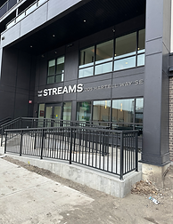 The Streams building front door entrance photo