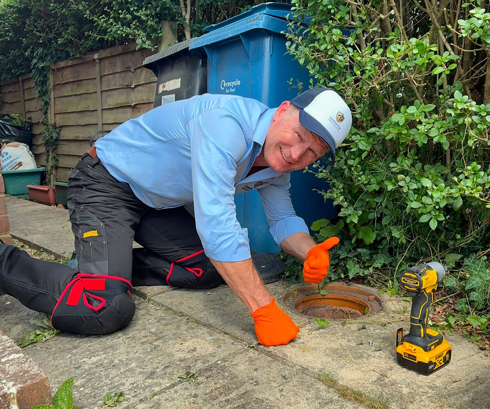 Pest technician checking drain for average pest control prices