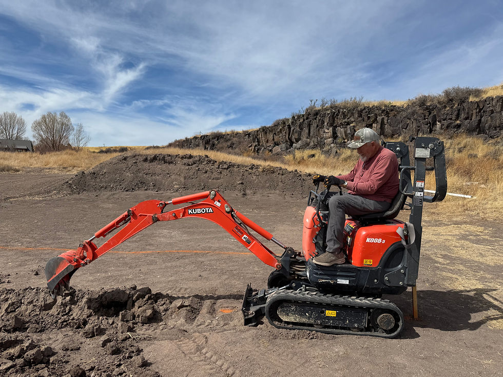 Mike quickly learned how to dig a trench with our son-in-law's mini excavator.