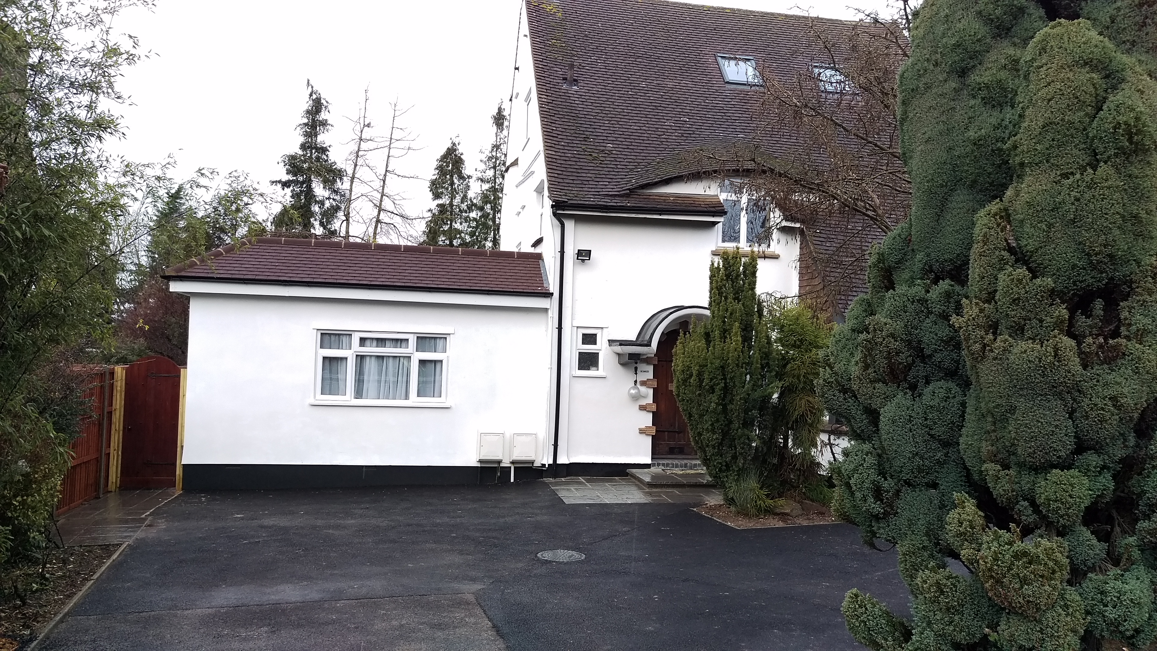 House extended/converted in flats.