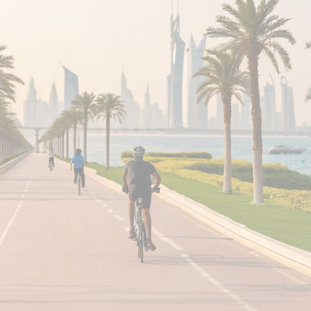 random bicycle rider at a corniche bike lane.jpg