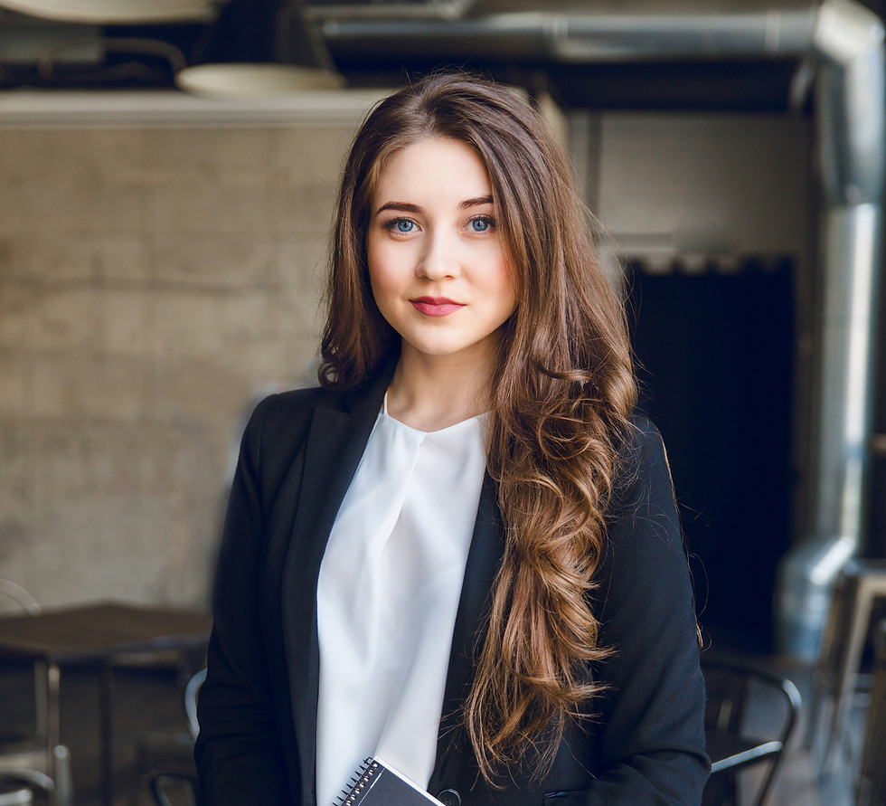 Professional woman holding notebook, wearing black blazer in office environment. Template 30