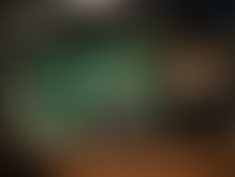 Open sign half lit in a shop window