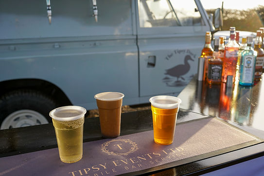 Tipsy Events luxury Land Rover mobile wedding bar with pints on the bar side