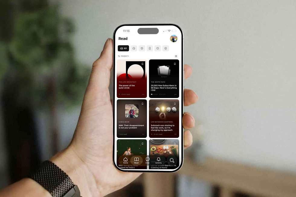 A person holds a smartphone displaying a reading app with various article thumbnails and categories on the screen.
