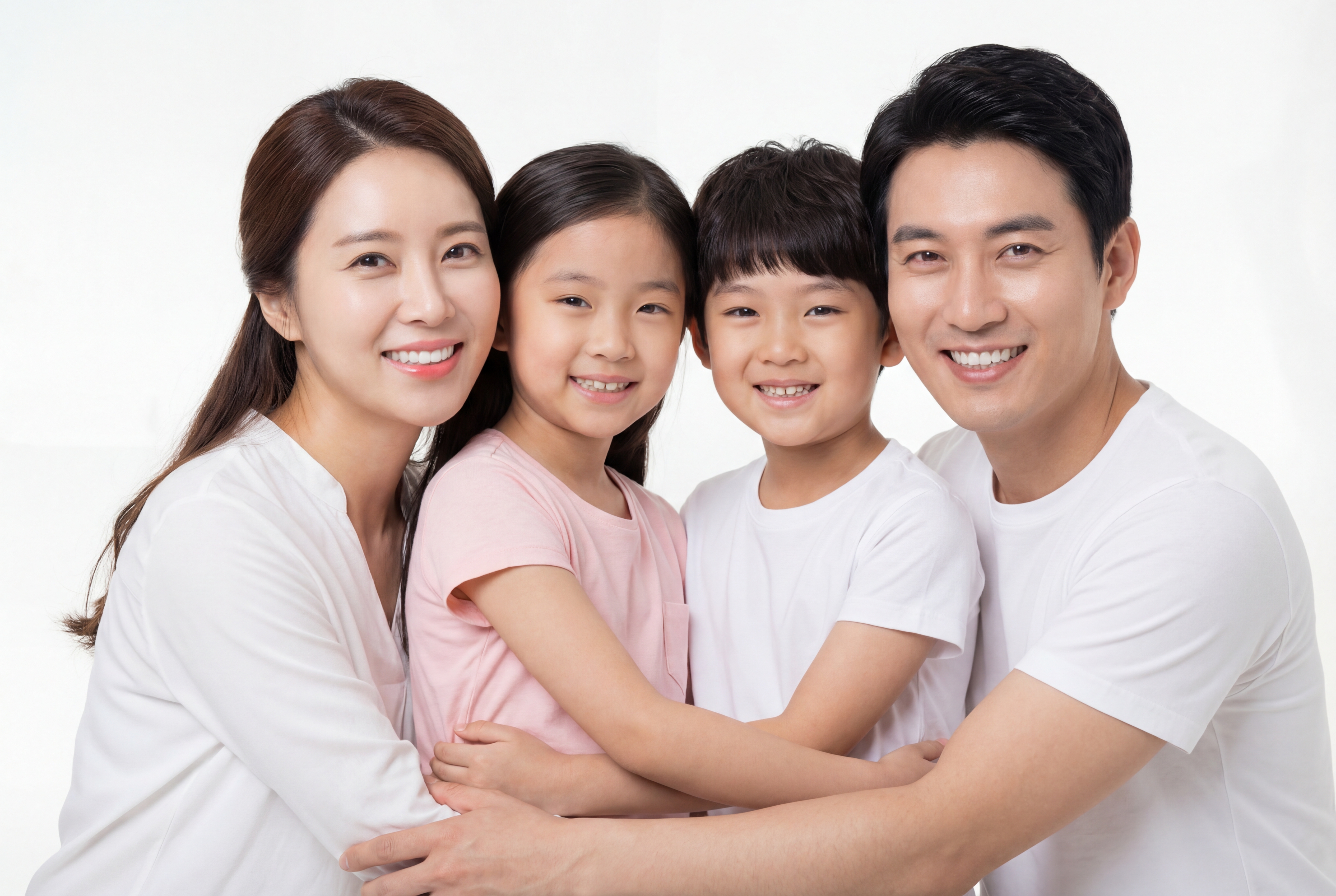 Smiling woman making a heart shape with her hands welcoming new patients to Soh Dental