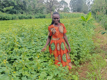 Kenyan farmer on her field where she uses SALM techniques.