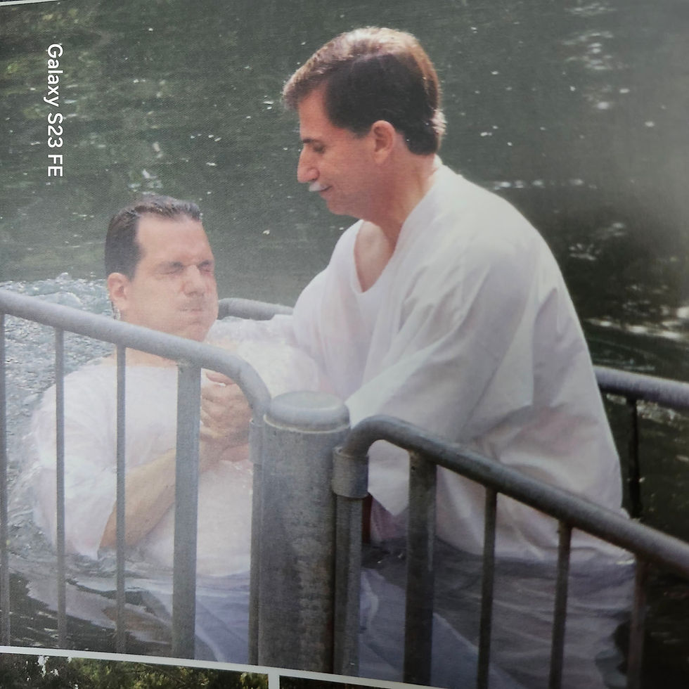 In the picture to the right my son is being baptized by me, when we were in Israel in the Jordon river