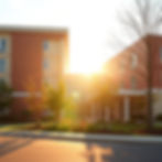 modern bright nursing home building, new construction, warm golden sunlight, realistic pho