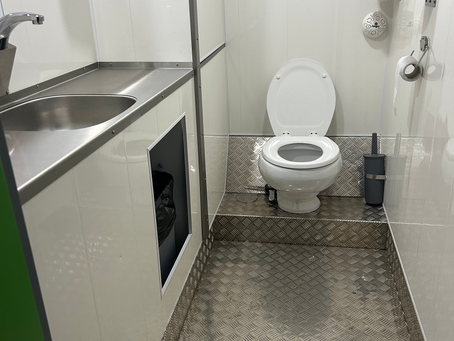 Clean welfare cabin toilet after an on-site clean during a railway blockade
