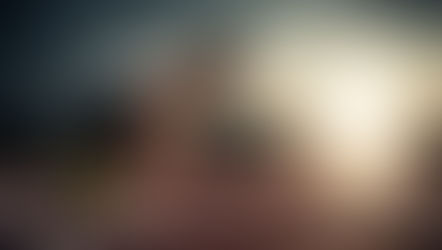 An athlete in the starting blocks of a running track, looking intently down the track toward a bright light at the finish line, symbolizing the Christian's "active wait" for Christ's return, living with purpose and holiness (Titus 2:11-13).