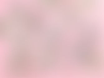 Rolled and stacked US dollar bills secured with rubber bands on a pink background, featuring various denominations including 100 and 5.