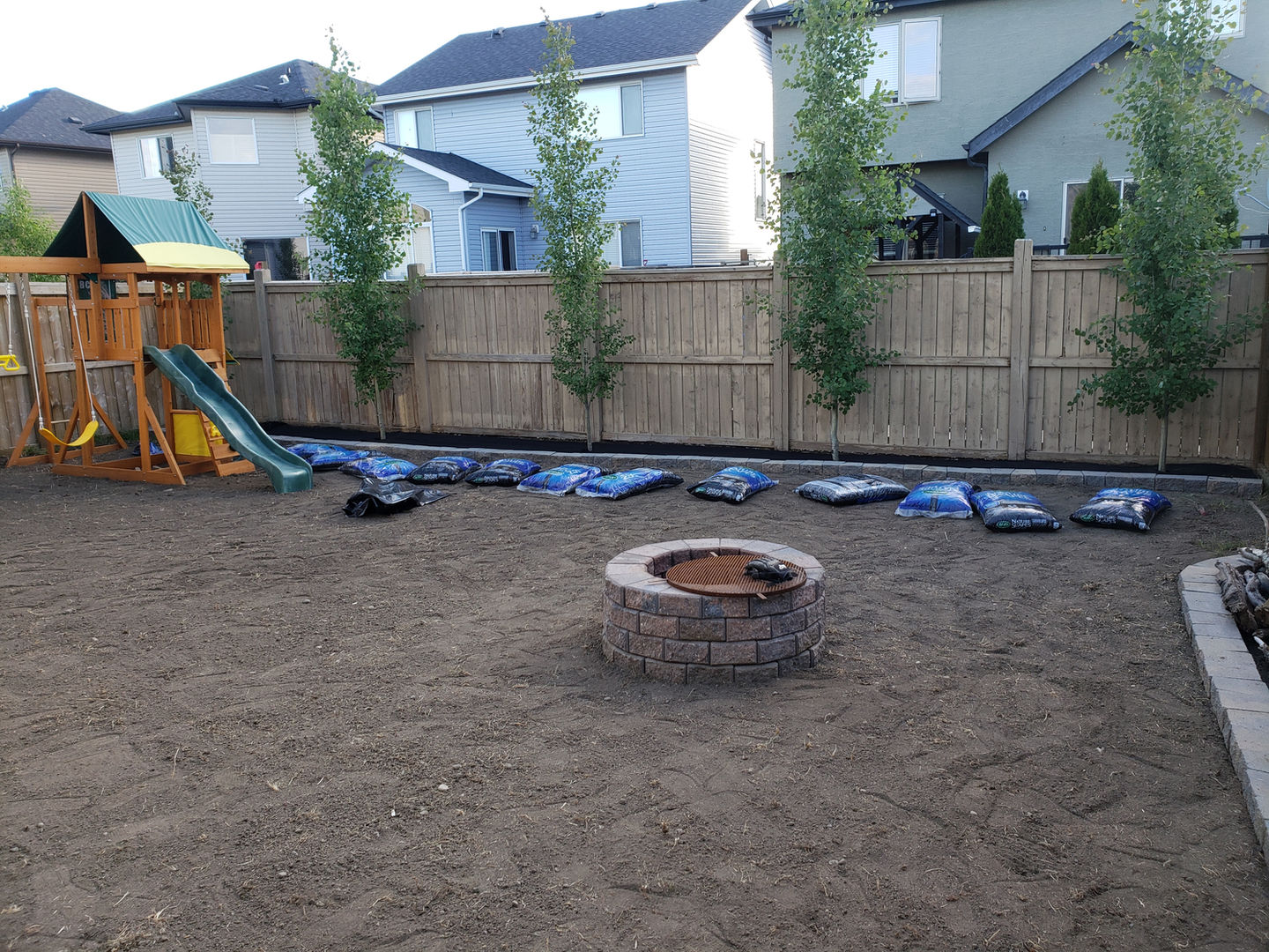 Landscape Sod Installation with brick fireplace in High River, Alberta
