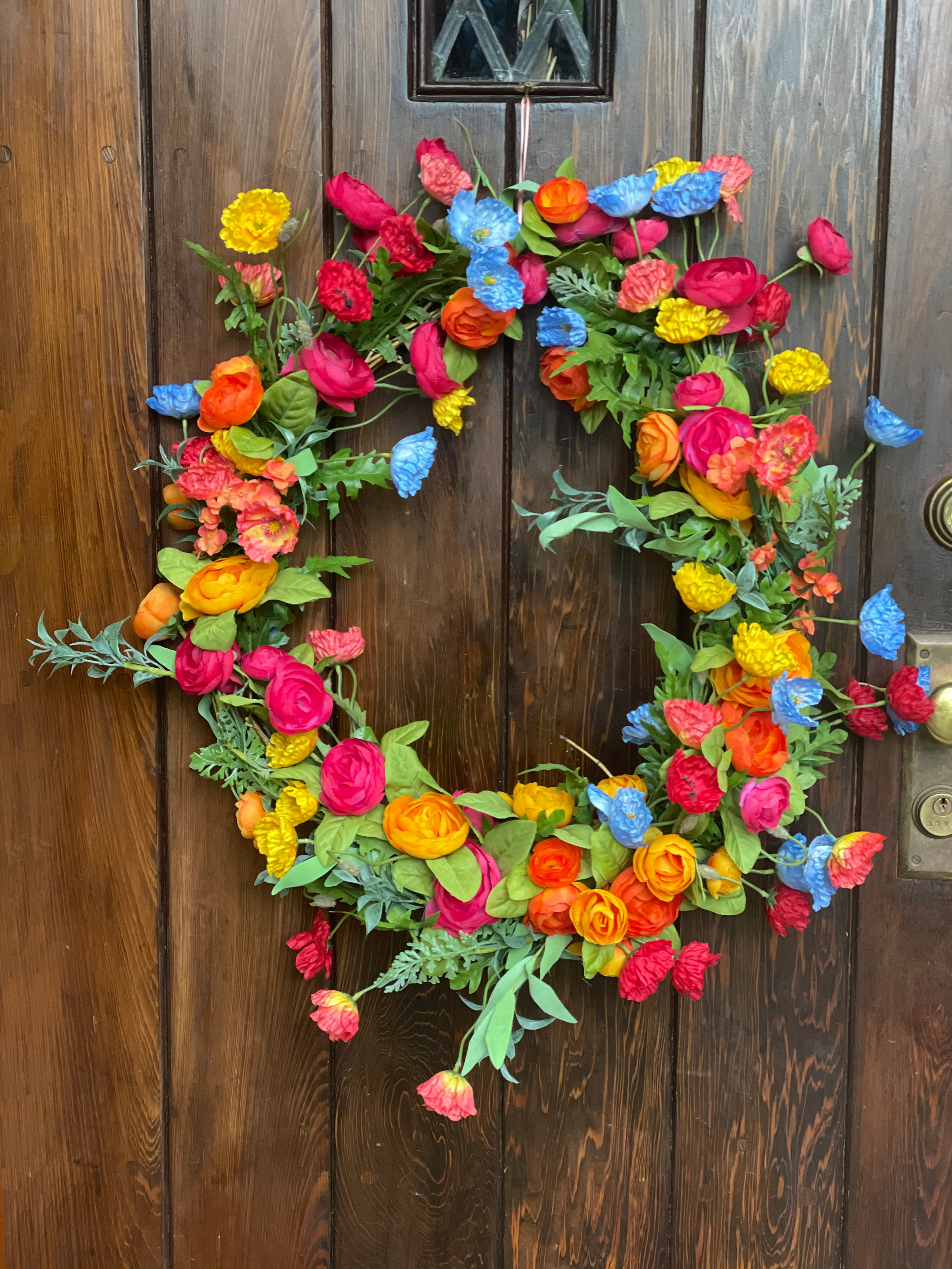 32) Orange, Red, Yellow, Blue Flowers and Poppies on a Vine Wreath